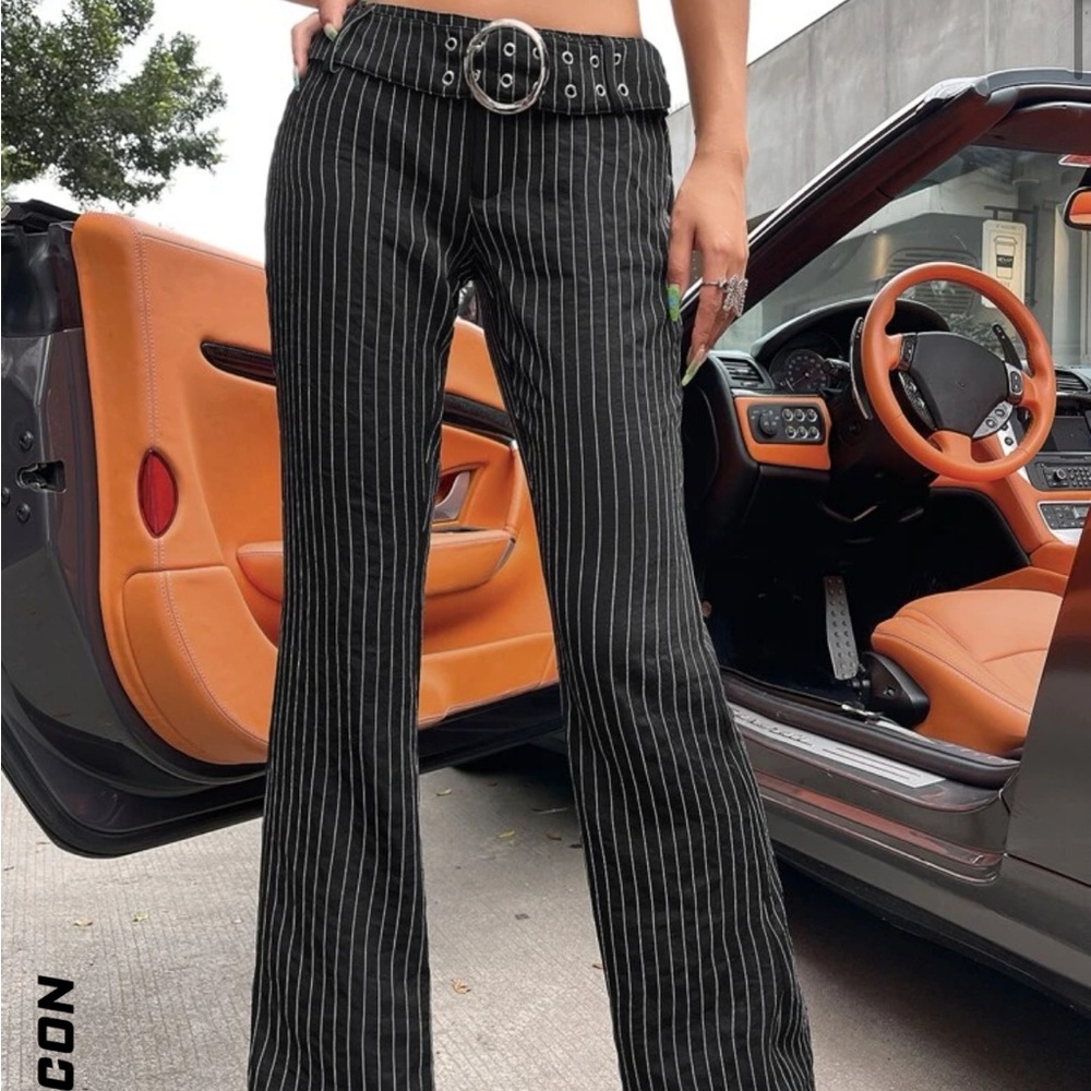 Low waist, black/white pin stripe buckle pants, flare.